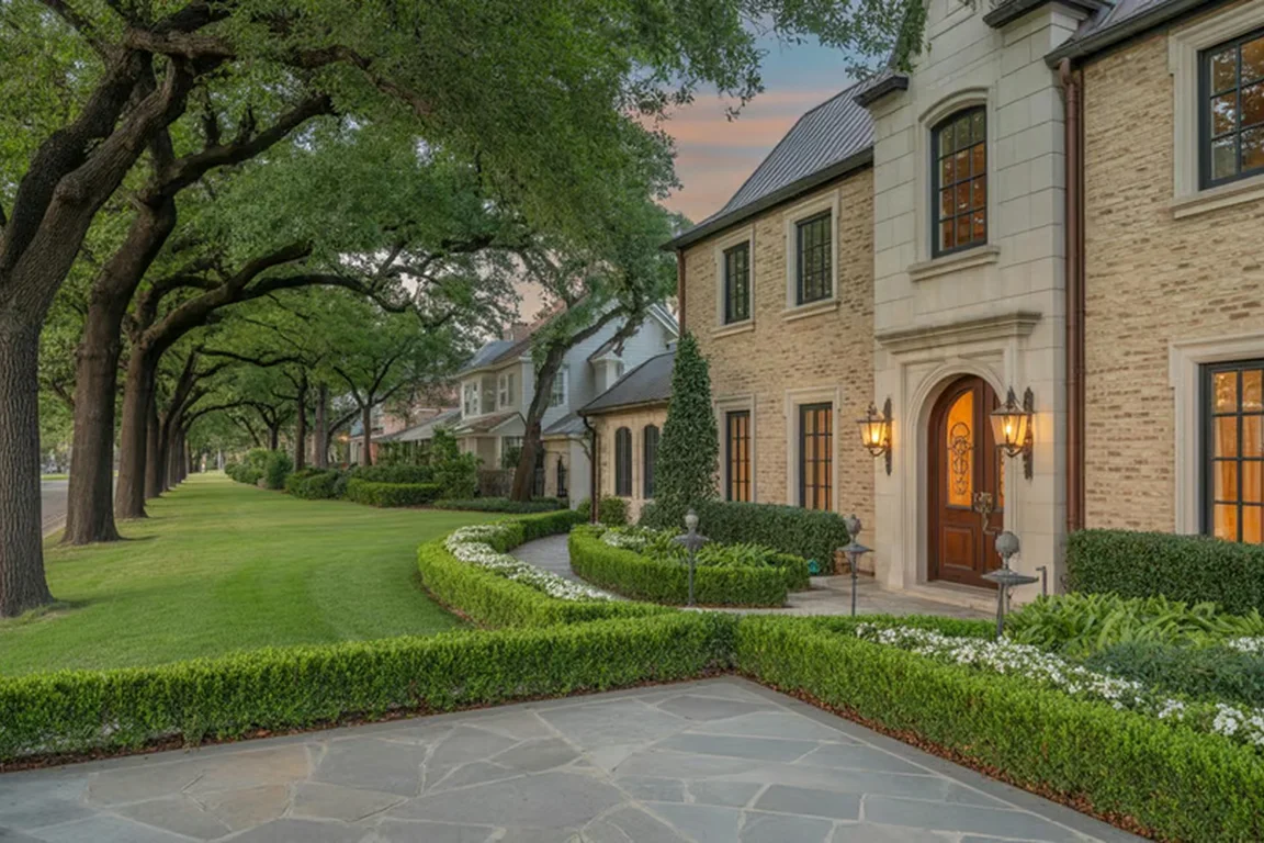 Tree-lined lawn and walkway beside residential homes